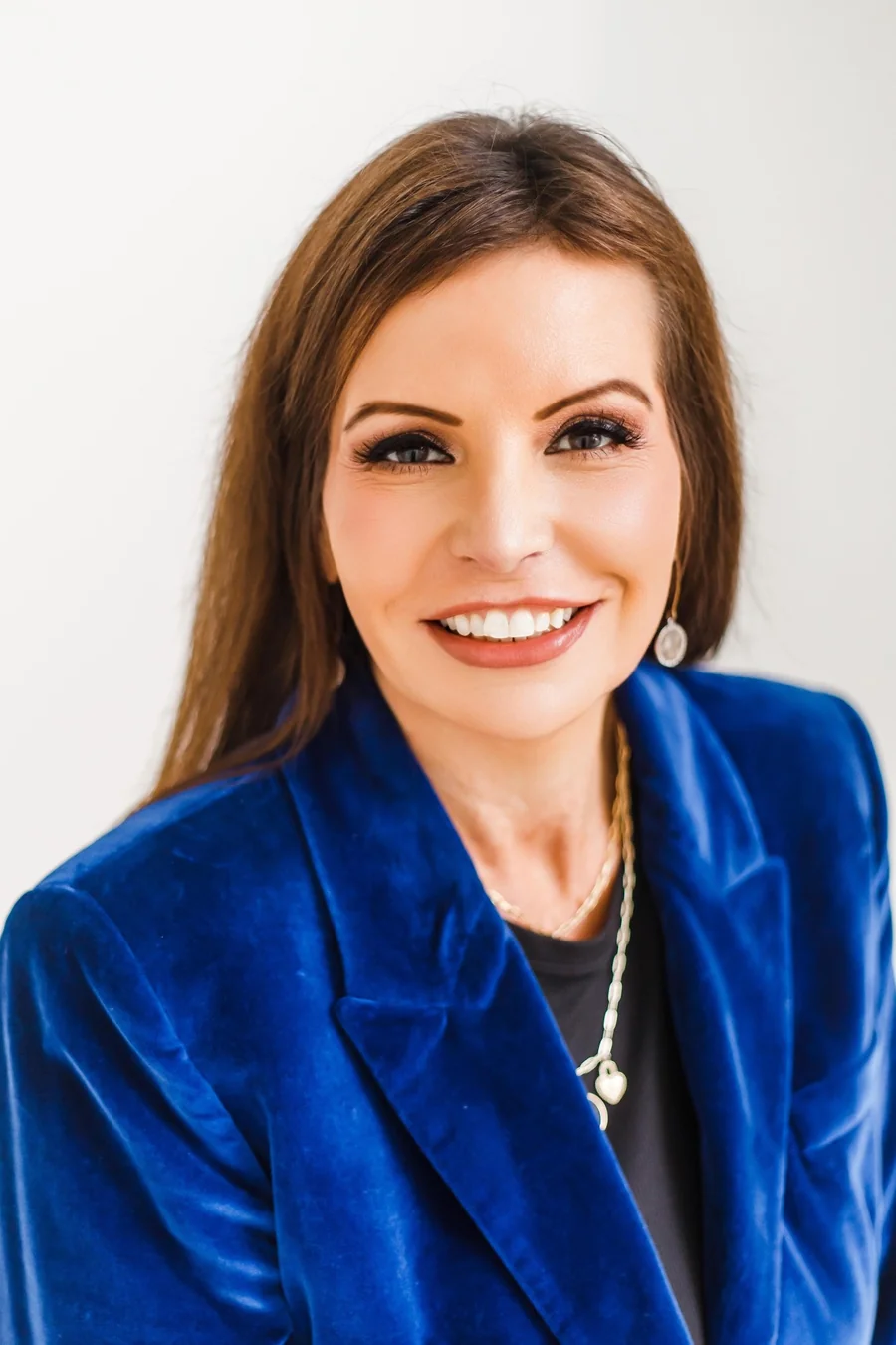 Carolyn Eichenhofer smiling in a blue blazer